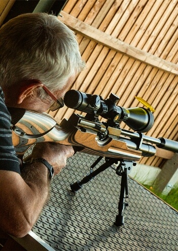Man firing A Gun At A Sporting Shooting Range