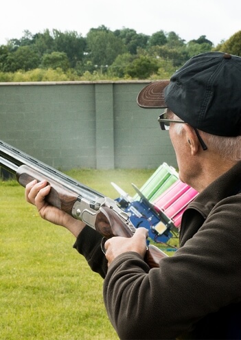 shooting-clay Man firing A Gun At An English Skeet Range
